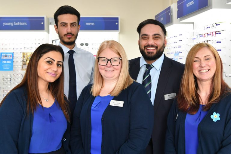 Local pensioner steps into the spotlight to officially open new opticians